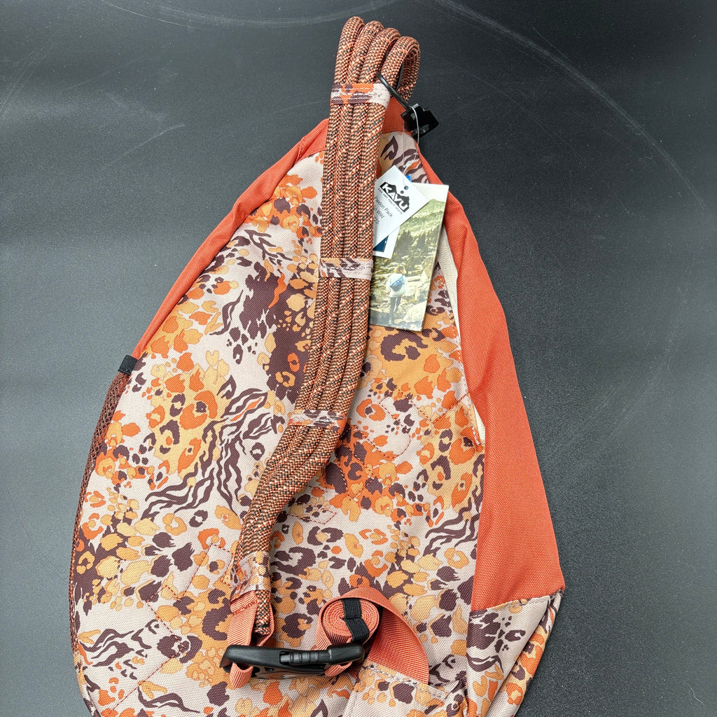 KAVU NWT Cross Body Paxton Pack Go Wild showcasing a durable strap and vibrant animal print design.