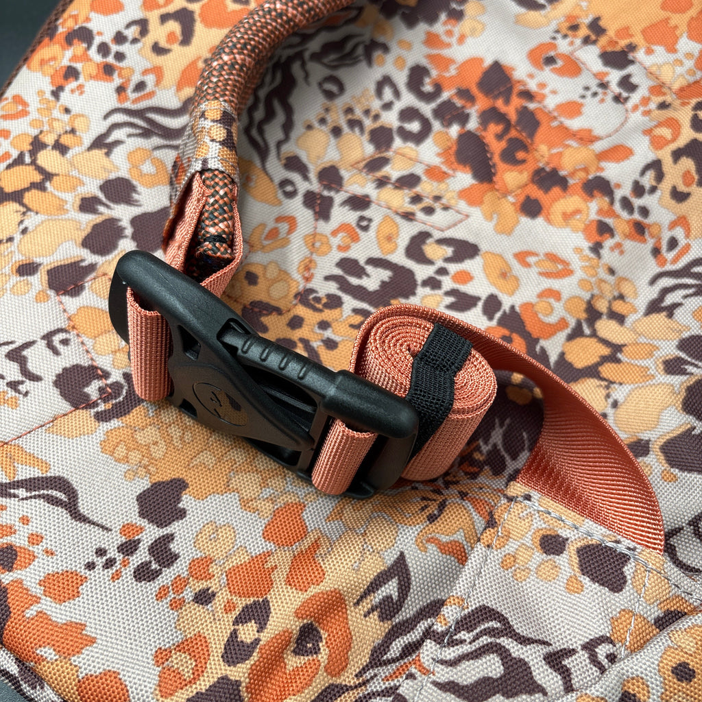 KAVU NWT Cross Body Paxton Pack Go Wild detailed view of buckle and strap design, showcasing ergonomic features.