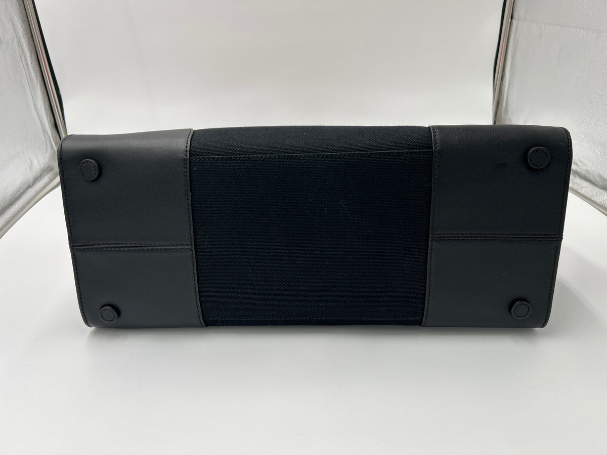 NWOT Ralph Lauren Two-Tone Devyn Canvas Tote w/2 RL storage bags bottom view showcasing durable black canvas and leather.
