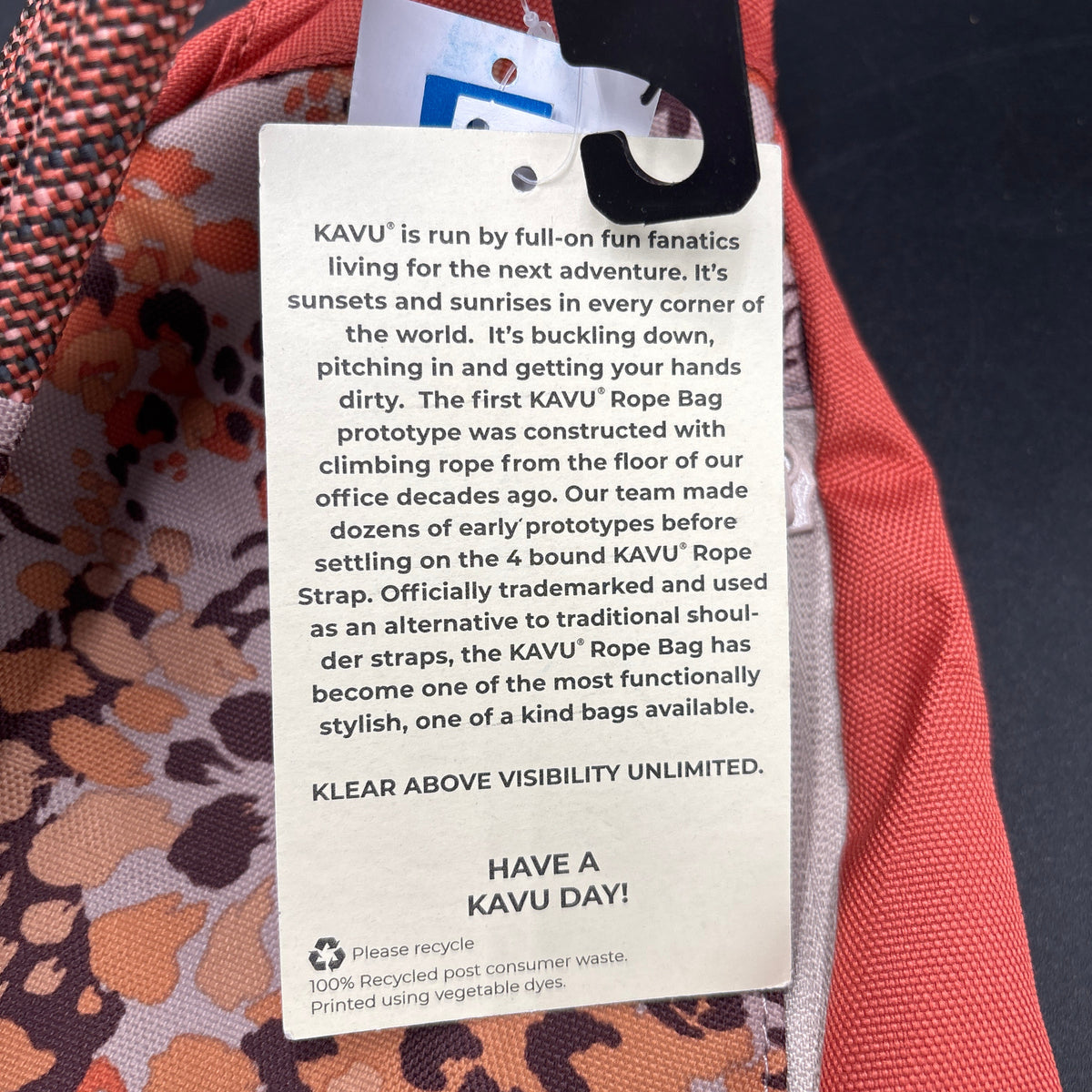 KAVU NWT Cross Body Paxton Pack Go Wild hangtag detailing features and design of the KAVU Rope Bag.