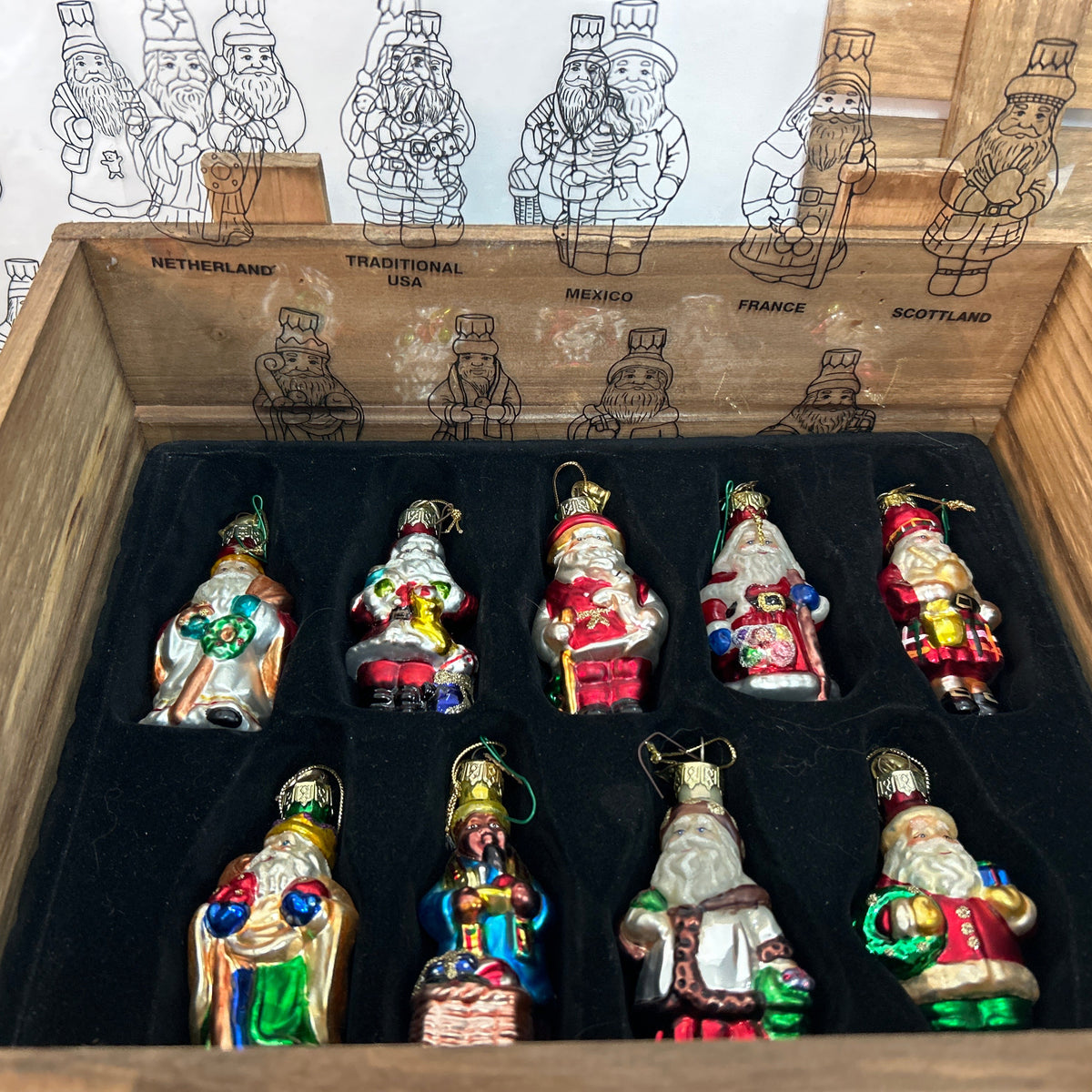Thomas Pacconi Classics "Santas around the World" is a highly collectible holiday series featuring meticulously hand-painted blown glass Christmas ornaments. Released primarily in the early 2000s (most notably the 2002 collection), a complete set consists of 18 unique Santa figures representing different global cultures and countries packaged with a signature protective wooden storage crate.