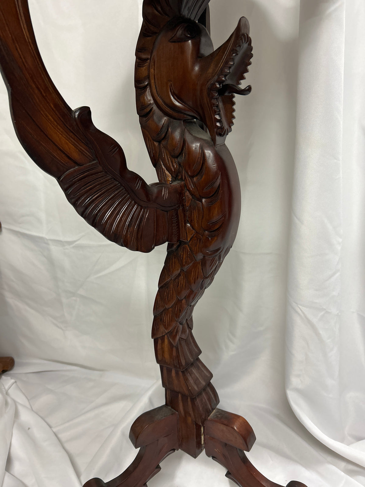 Carved Dragon Pedestal Table showcasing intricately detailed dragon pedestal and elegant serpentine design.