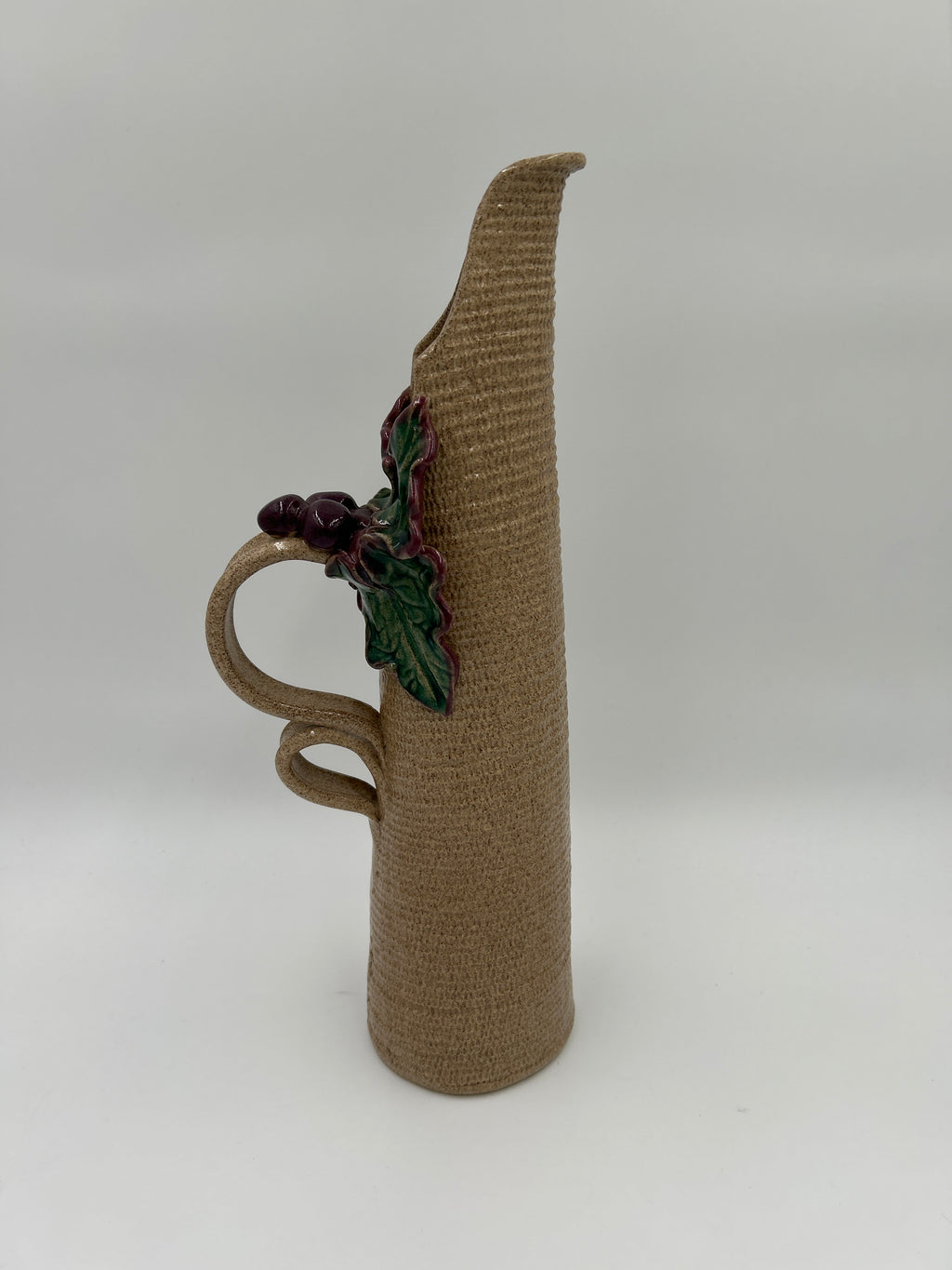Jana Kozon Kausalik Studio Art Pottery Ewer Pitcher Vase 3D Grapes Leaves with textured tan stoneware and grapevine detail.