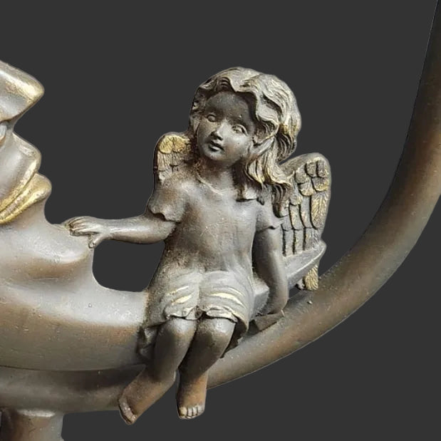 vintage celestial angel fairy bronze finish cast metal base with 2 glass blue lily lights. Angel close up
