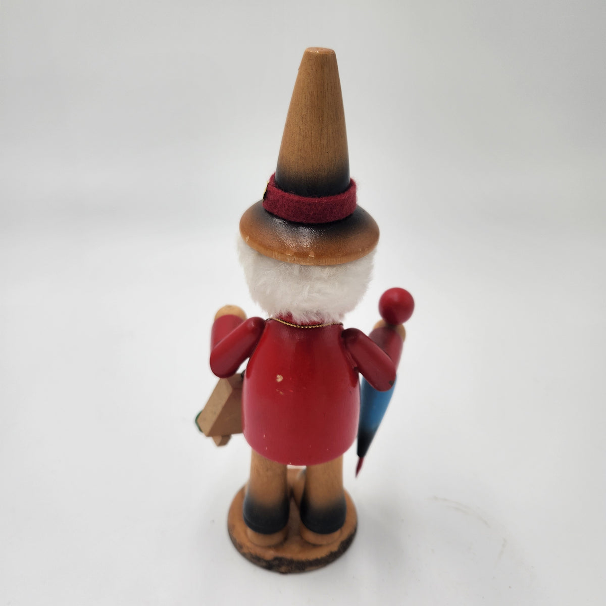 Vintage German Wood Smoker Erzgebirge Handcrafted figure shown from behind, showcasing craftsmanship and colorful details.