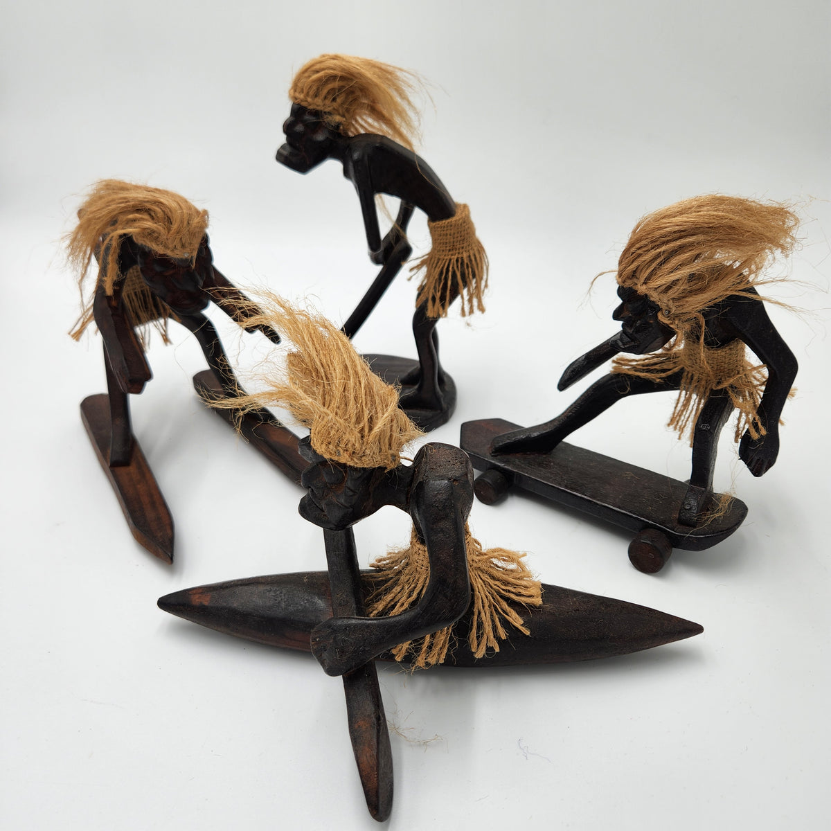 Lot of 4 Vintage Wood Tiki Tribal Men Figurines Surfer Skateboard Ski Golf Decor