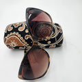 Vera Bradley Felicia (VB-909) Sunglasses Tortoiseshell w/ Paisley Case displayed on a paisley-print case.