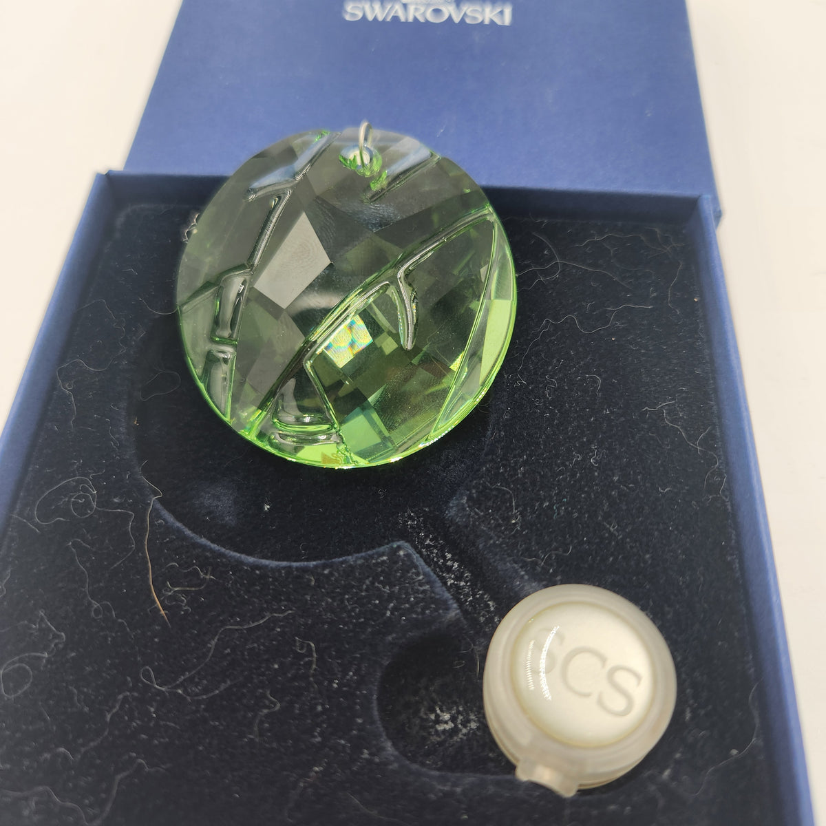 Swarovski Austrian Crystal 2008 Round Green Membership Window Ornament in box, showcasing its rich peridot green brilliance.