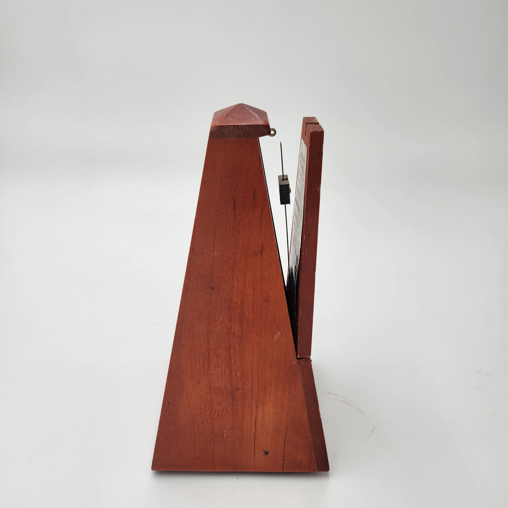 Seth Thomas wooden pyramid metronomes side view showcasing classic wooden design and precision ticking.
