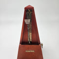 Seth Thomas wooden pyramid metronomes showcasing a close-up view of the metronome mechanism and markings.
