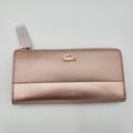 NWT Lacoste Chantaco Rose Gold Metallic Pique Leather Large Zip Around Wallet Clutch in sleek design and luxurious finish.