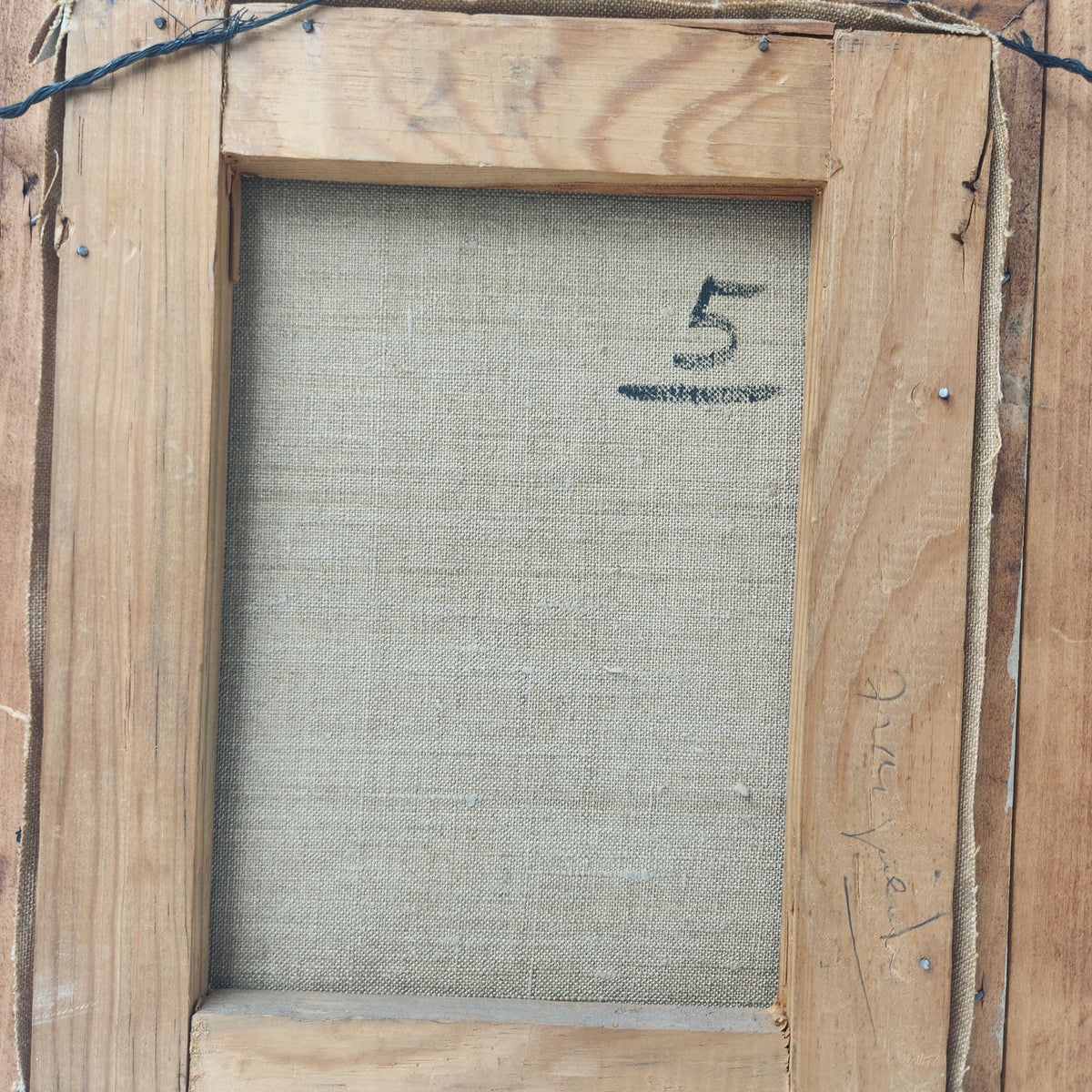 Back view of a vintage framed oil canvas painting with a number "5" marked.