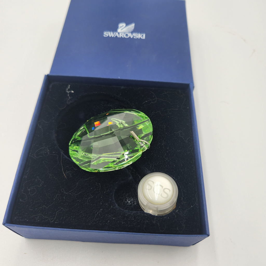 Swarovski Austrian Crystal 2008 Round Green Membership Window Ornament displayed in its luxurious blue box.