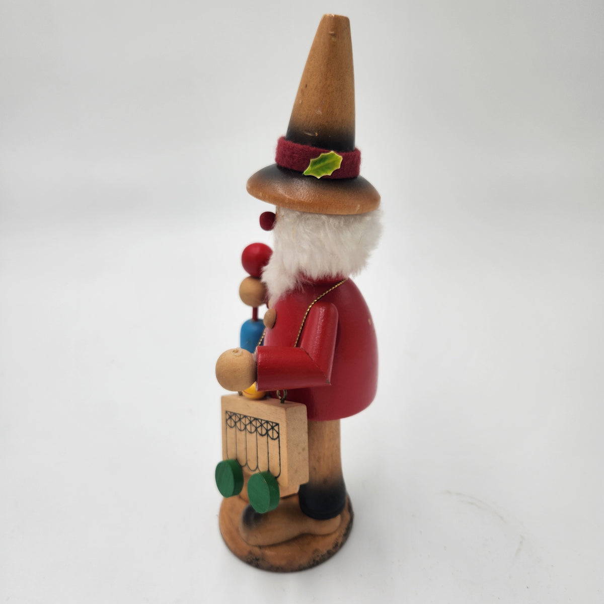 Vintage German Wood Smoker Erzgebirge Handcrafted decorative figure with a red coat and adorable accessories.