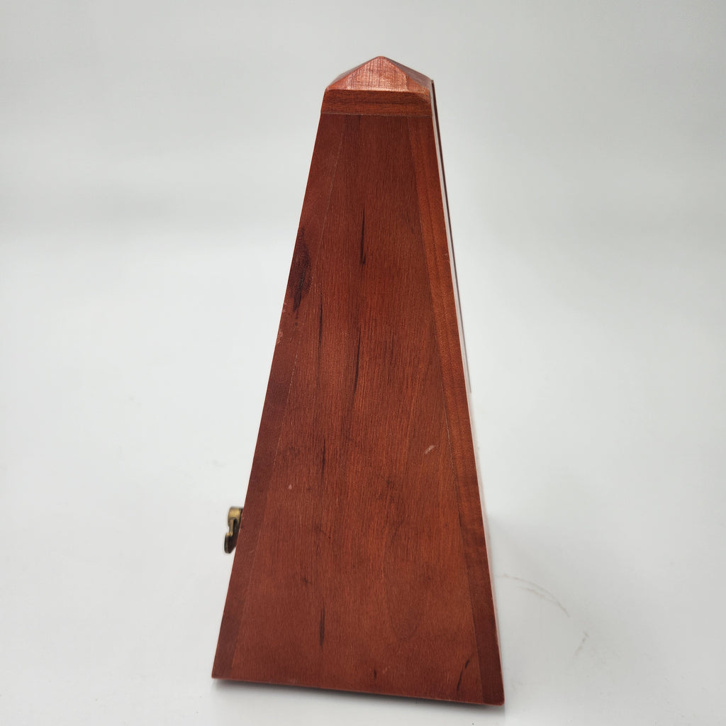 Seth Thomas wooden pyramid metronomes side view showcasing smooth wooden finish and classic pyramid shape.