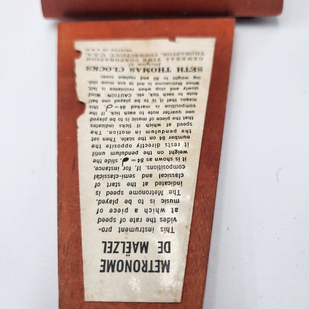 Seth Thomas wooden pyramid metronomes instruction label detailing functionality and design features.
