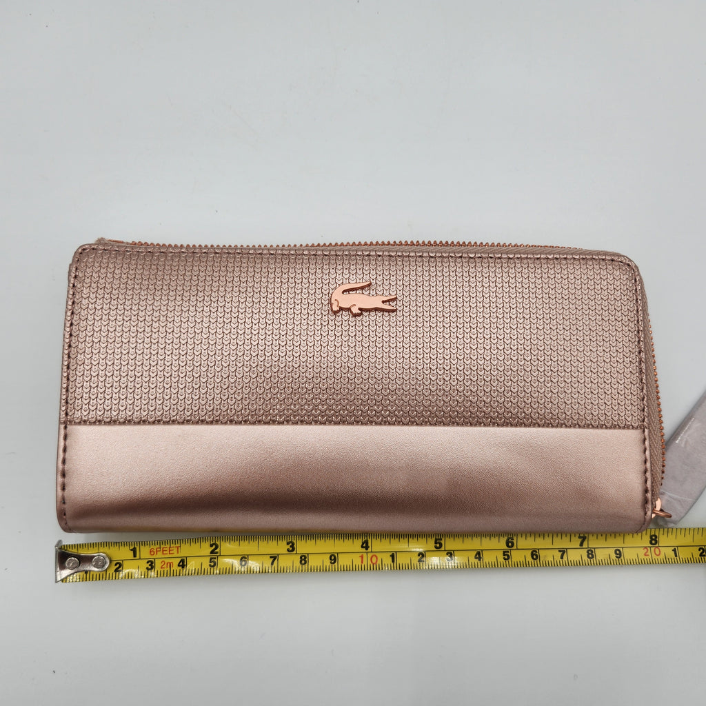 NWT Lacoste Chantaco Rose Gold Metallic Pique Leather Large Zip Around Wallet Clutch shown with measurement for size