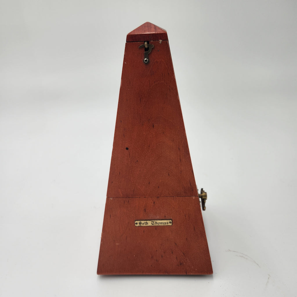 Seth Thomas wooden pyramid metronomes, showcasing a classic wooden design and the Seth Thomas nameplate.