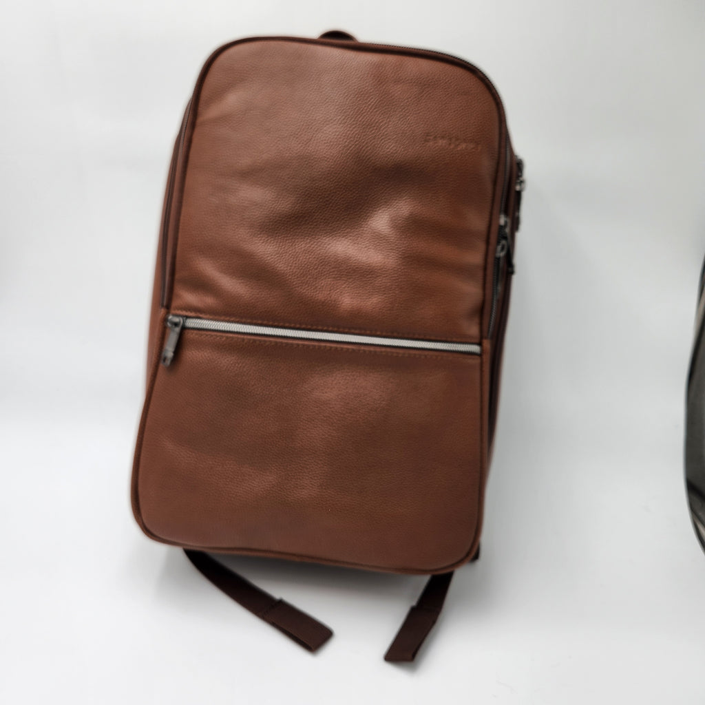 A brown textured leather Samsonite backpack with a horizontal zippered pocket, shown on a plain white background.