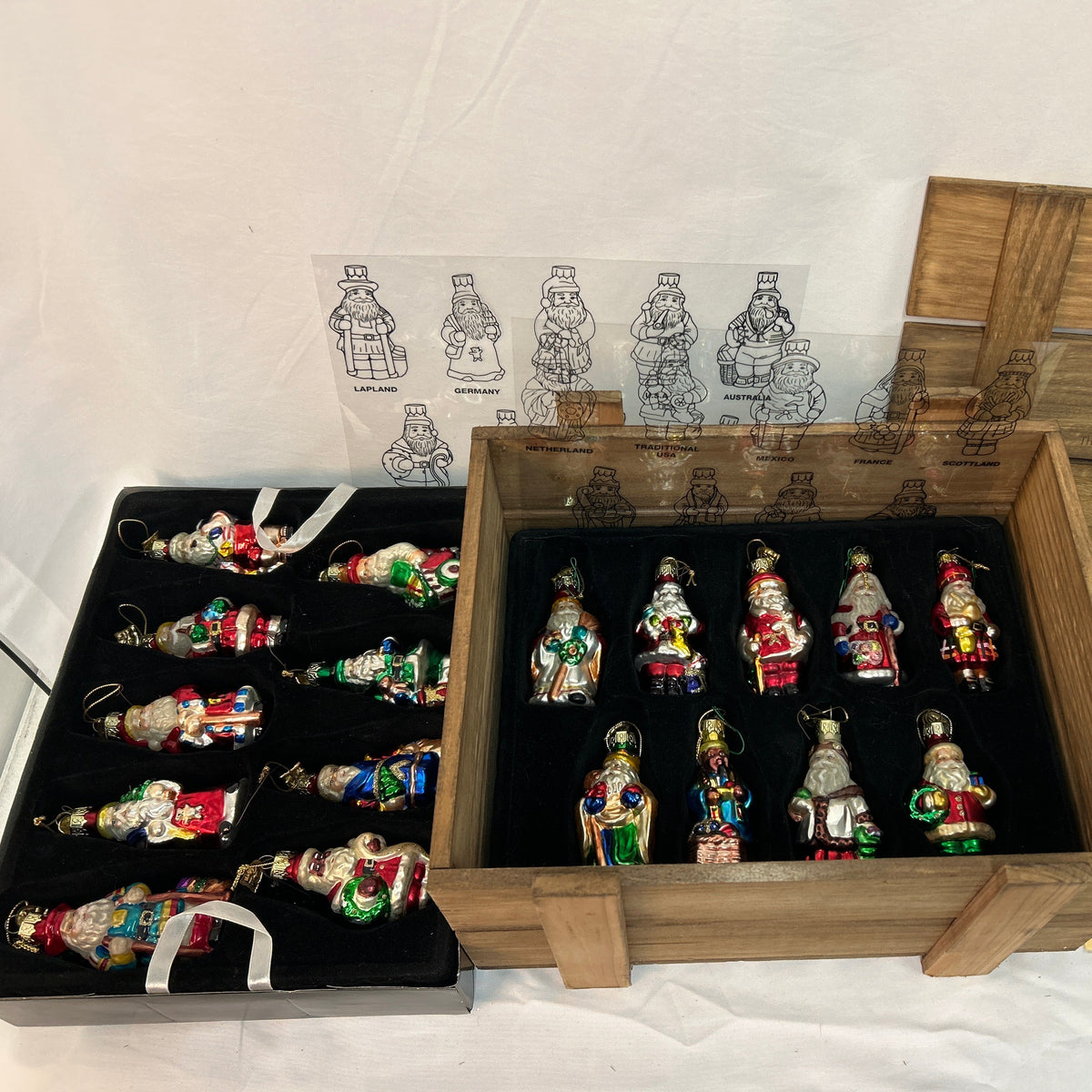Thomas Pacconi Classics "Santas around the World" is a highly collectible holiday series featuring meticulously hand-painted blown glass Christmas ornaments. Released primarily in the early 2000s (most notably the 2002 collection), a complete set consists of 18 unique Santa figures representing different global cultures and countries packaged inside a signature protective wooden storage crate.