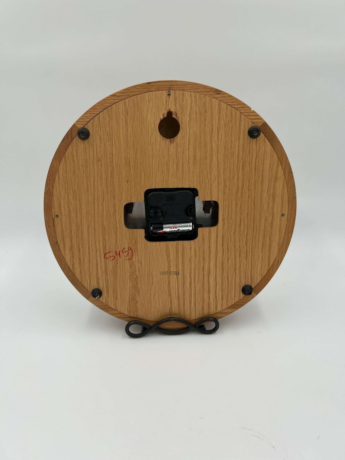 Back view of the Vintage LL Bean Weather Station Wall Clock in solid oak wood, featuring battery compartment and stand.